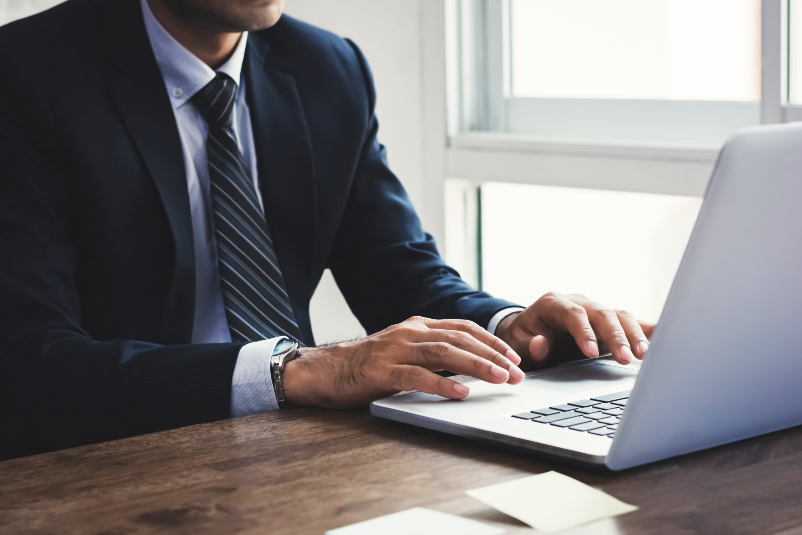 Businessman working on notebook computer in the office
