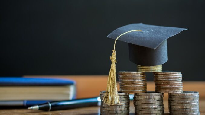 hat graduation model on money coins saving for concept investmen