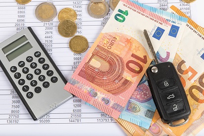 Financial statement with coins and banknotes. Finance and car ke