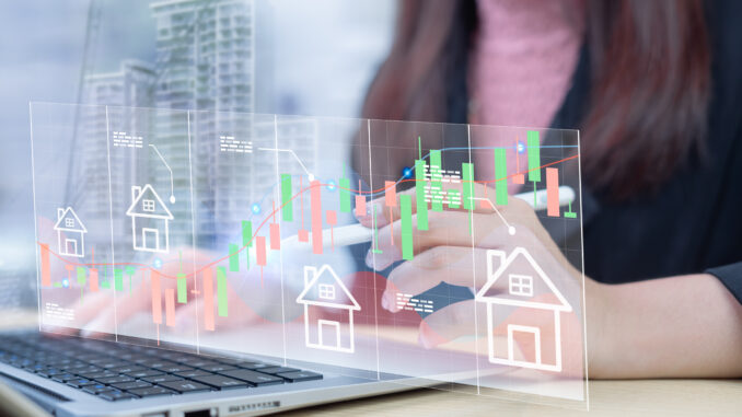 Businesswoman analyzes real estate investment graph in stock market, stock market real estate investment concept, long-term and short-term stock market investment approach.
