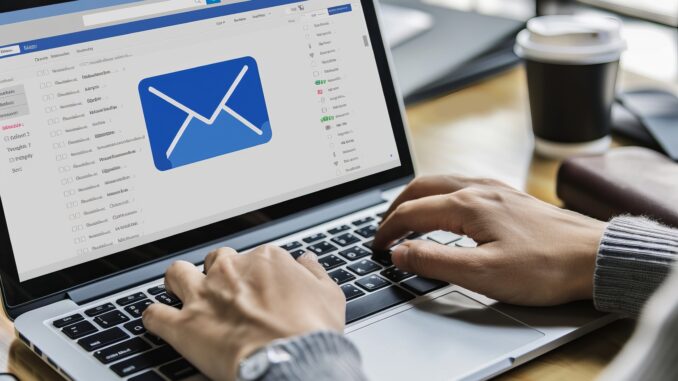 Clean and minimalistic geometric envelopes showing emails displayed on laptop screen