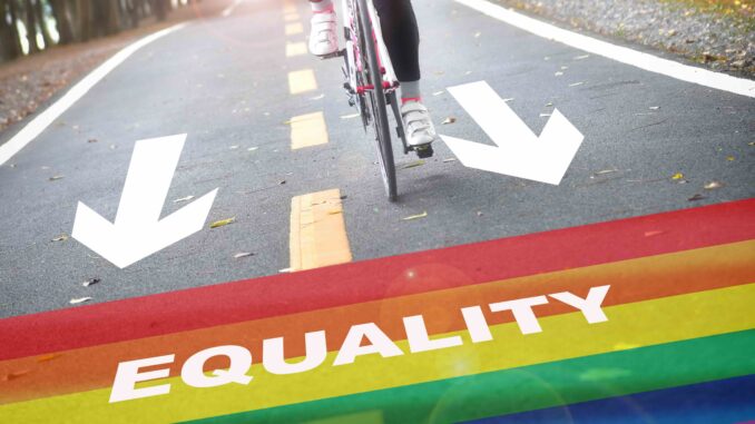 Equality,Written,On,Rainbow,Flag,Marking,On,Road,With,White