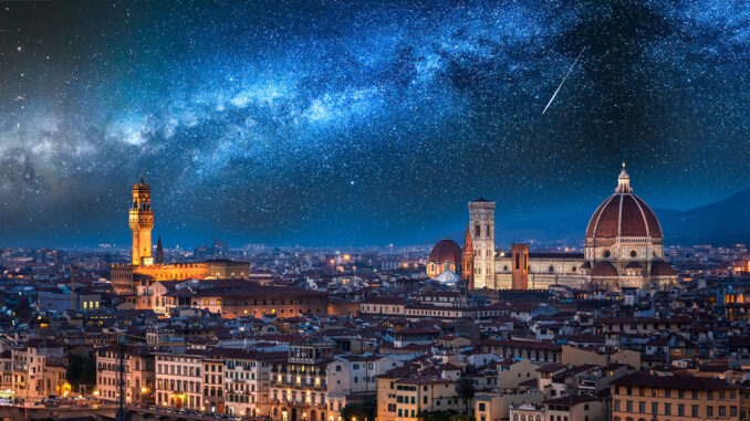 Milky way and falling stars over Florence at night, Italy