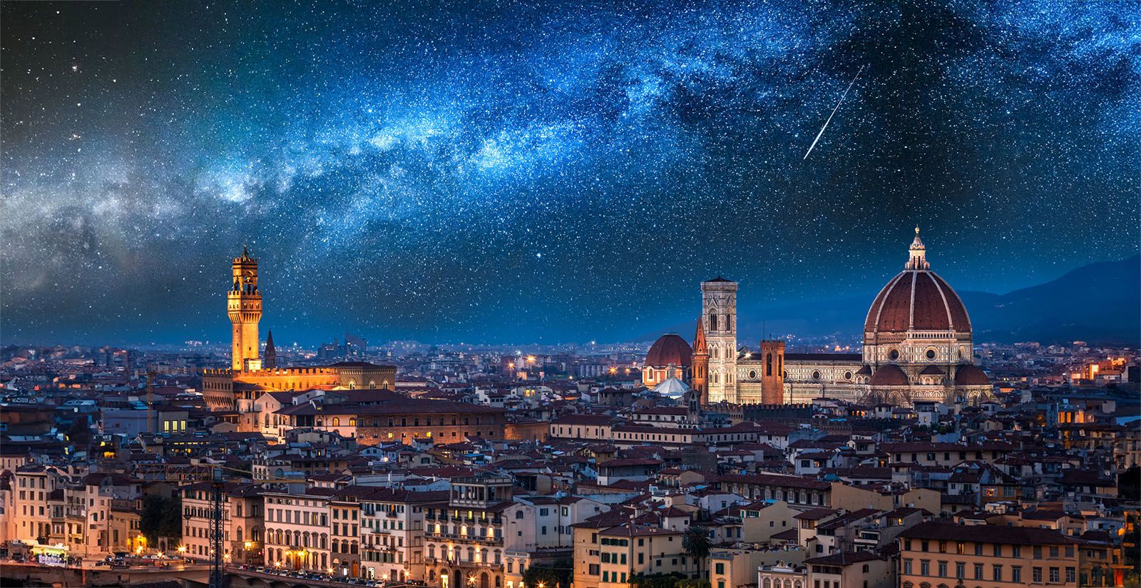 Milky way and falling stars over Florence at night, Italy
